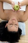 High Angle View Of Smiling Woman Holding Apple Stock Photo