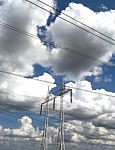 High Voltage Pilons And Storm Clouds Stock Photo