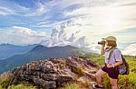 Hiker Teen Girl Holding A Camera For Photography Stock Photo