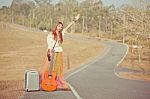 Hippie Girl Hitchhiking Stock Photo