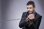 His Hands Are In Chains Stock Photo