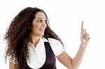 Hispanic Female Pointing Upwards Stock Photo