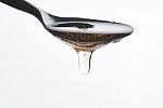 Honey On A Spoon Stock Photo