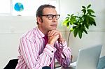 Idle Corporate Guy In Office Looking Sideways Stock Photo