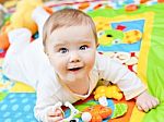 Infant Boy On Playmat Stock Photo