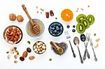 Ingredients For A Healthy Foods Background, Nuts, Honey, Berries Stock Photo