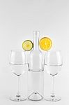 Isolated Bottle And Glasses With Lemon And Lime Stock Photo