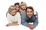 Joyful Family Of Four, Studio Shot Stock Photo