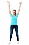 Joyous Female Raising Arms In Excitement Stock Photo