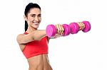 Joyous Fit Woman Lifting Dumbbells Stock Photo