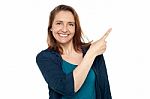 Joyous Smart Woman Pointing Away Stock Photo