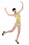 Joyous Woman In Green Lingerie Dancing In Joy Stock Photo