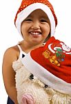 Kid With Toy And Santa Hats Stock Photo