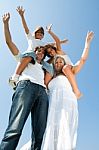 Kids ride on parents shoulder Stock Photo