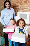 Kids With Dad And Pizza Boxes Stock Photo