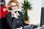 Lady Attending Clients Call Stock Photo