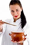 Lady Chef Showing Chopstick And Pot Stock Photo