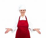 Lady Chef Standing With Open Palms Stock Photo