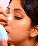 Lady Cleaning Make Up Stock Photo