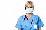 Lady Doctor Wearing Surgical Mask Stock Photo