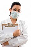 Lady Doctor With clipboard And Mask Stock Photo