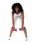 Lady Doing Dumbbell Exercise Stock Photo