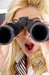 lady looking through Binocular Stock Photo