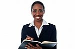 Lady Making A List Of Appointments Stock Photo