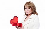 Lady Opening Heart Shaped Gift Box Stock Photo