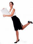 Lady Raising Her Leg With Laptop Stock Photo