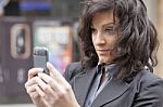 Lady Reading Sms In Street Stock Photo