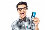 Laughing Guy Holding Credit Card Stock Photo