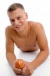 Laying Fit Guy With Apple Stock Photo