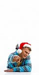 Laying Man With Christmas Hat Stock Photo