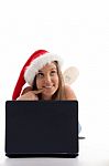 Laying Woman With Christmas Hat And Notebook Stock Photo