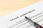 Lease Agreement Contract Document, Pen At Bottom Right Corner Stock Photo