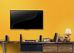 Led Tv On Concrete Wall With Wooden Furniture In Living Room Stock Photo