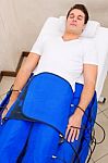 Legs Pressotherapy Machine On Man In Beauty Center Stock Photo