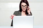 Lets Call It A Day. Woman Shutting Down Laptop Stock Photo