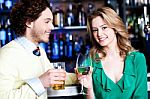 Let's Celebrate. Young Couple At Nightclub Stock Photo