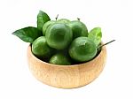 Lime And Leaf In Wood Bowl With Isolate White Background Stock Photo