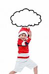 Little Asian Boy In Santa Hat Funny Acting Isolated On White Stock Photo