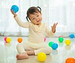 Little Asian Girl In Home Stock Photo