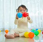 Little Asian Girl In Home Stock Photo