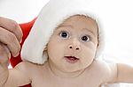 Little Baby Wearing Santa Hat Stock Photo