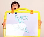 Little Boy Holding A Whitebaord Stock Photo