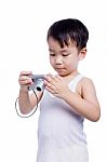 Little Boy  Interesting Digital Compact Photo Camera Stock Photo