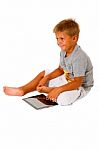 Little Boy Using Digital Tablet Stock Photo