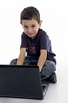 Little Boy Working with Laptop Stock Photo