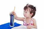 Little Girl Choosing Colour Pencil For Draw Picture Stock Photo